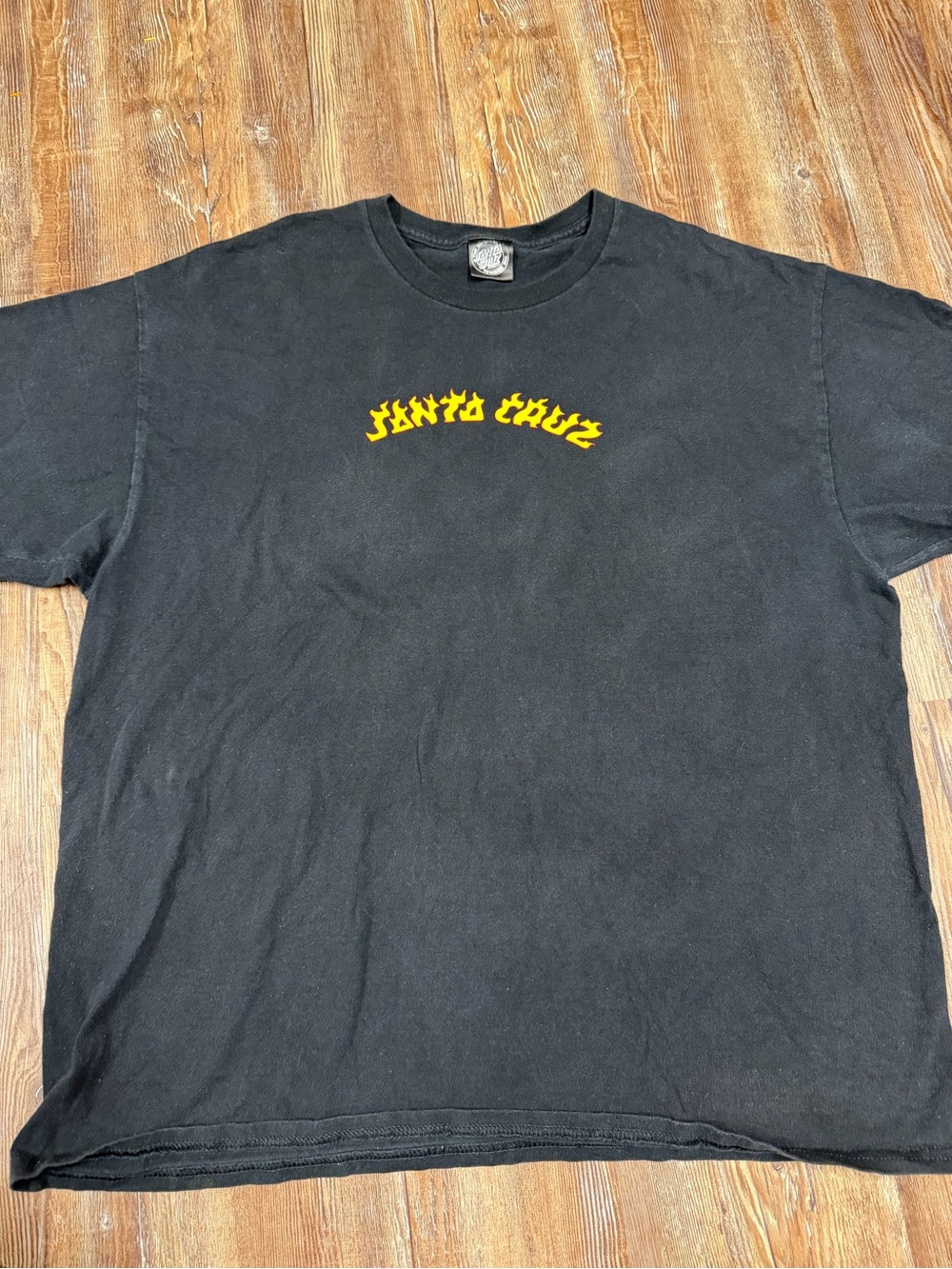 Santa Cruz Skateboards black t-shirt with yellow 'SANTA CRUZ' text